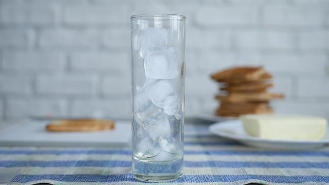 Ice Cubes in an Empty Glass Waiting for Fresh Water for a Chill Drink