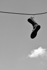 A view from the bottom of the shoe hung from the wire