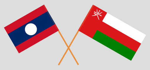 Crossed flags of Oman and Laos