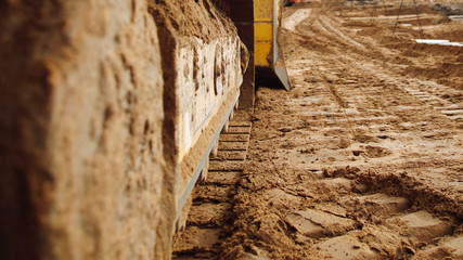 Continuous caterpillar tracks of the bulldozer. Close up. detail of a rusty tractor tracks