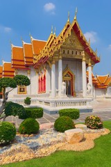 Naklejka premium Temple of Wat Benchamabophit, located in Bangkok, Thailand, also known as the Marble Temple. Side front view.
