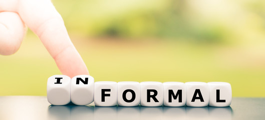 Hand turns a dice and changes the word 