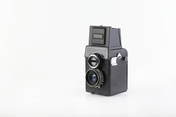 The old medium format film TLR camera on white background.