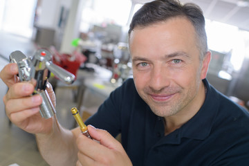 portrait of a happy male plumber