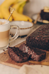 Vegan chocolate banana cake on a wooden board