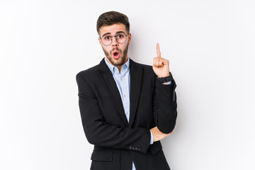 Young caucasian business man posing in a white background isolated Young caucasian business man having some great idea, concept of creativity.