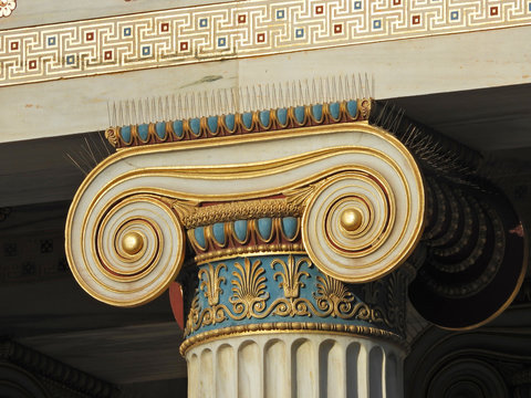 Extreme close up photo revealing great detail in iconic ancient Greek style golden pillars of Academy of Athens, Attica, Greece