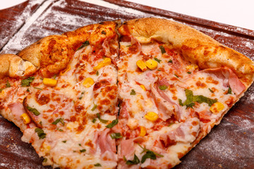 Delicious italian pizza served on wooden table. Pizza Italian Fastfood Cooking Kitchen.