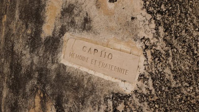 Close up footage of  name on Memorial de l'Anse Caffard Slaveryl.