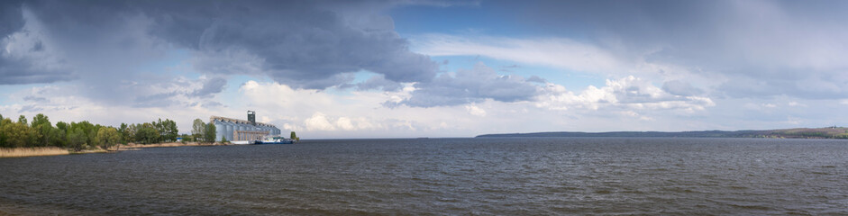 Obraz premium Panoramic view. Elevator, Nibulon granary on the Dnieper River in Cherkasy region, Ukraine