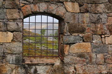 View through the barred window of an old railway turntable at Riksgransen in Sweden © jojoo64