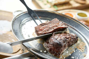 Various grilled meat set with Pickled cabbage and two sauces. Serving on a wooden Board. Barbecue restaurant menu, a series of photos of different meats.