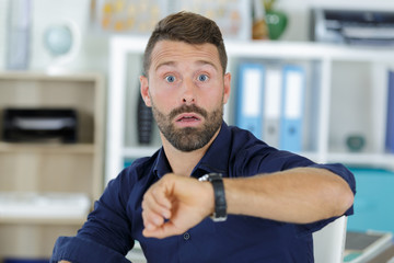 Naklejka premium a worried man checking time