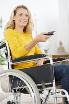 woman in wheelchair changing tv programme