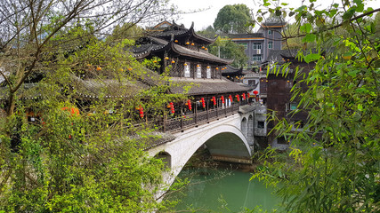 Fototapeta na wymiar beautiful bridge in ethnic ancient chinese style. Furong town