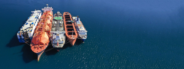 Aerial drone ultra wide photo of old industrial tanker ships not any more in service - docked near Mediterranean destination port