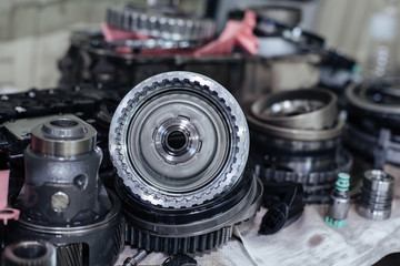 Fototapeta na wymiar Auto gearbox parts at shallow depth of field