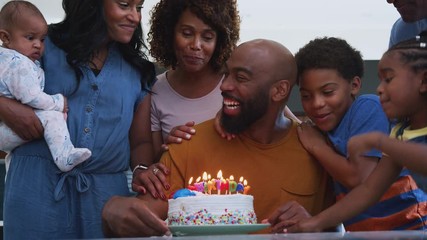 Multi-Generation African American Family Celebrating Fathers Birthday At Home Together