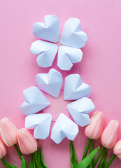 paper hearts shape figure eight 8 on soft pink with tulips flowers International Women's Day card	