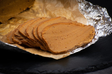 Vegan seitan ham prepared with wheat gluten and chickpea flour, soy sayce and spices