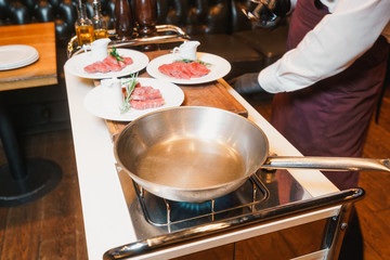 Chef getting ready to cook in front of visitors