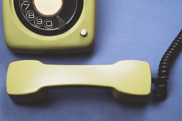 Classic phone with handset. vintage green telephone with phone receiver. office background. old communication technology