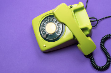 Classic phone with handset. vintage green telephone with phone receiver. office background. old communication technology