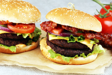 Tasty fresh meat burgers with salad and cheese. Homemade angus burger.