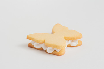 Cooking dough from a butterfly shape on a white background