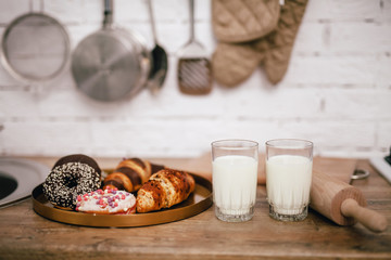 composition of croissants and milk in the kitchen