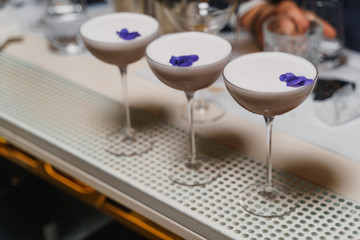 Beautiful coffee cocktails decorated with violet flower petals