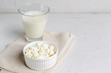 Homemade fermented beverage in a glass of kefir or Bulgarians and cottage cheese on a white...