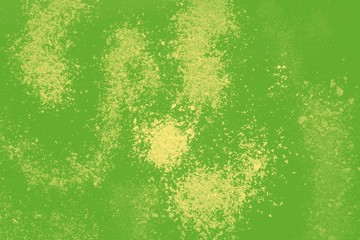 Abstract green background with pale yellow powder spots