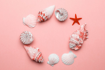 Shells background. Frame of White seashells, red starfish isolated on trendy Living Coral pastel color backdrop. Hello Summer is coming concept