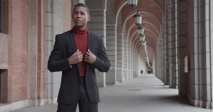 attractive black Hispanic young guy male businessman successful manager in a classic suit posing 