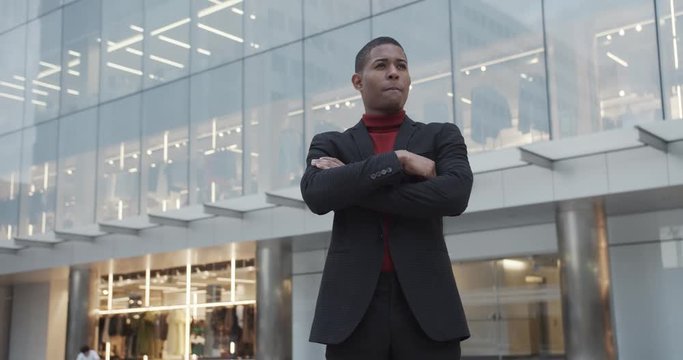 attractive black Hispanic young guy male businessman successful manager in a classic suit posing  
