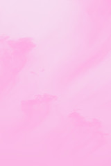 Beautiful clouds on a sky background. Clouds like a brush strokes, pink toned