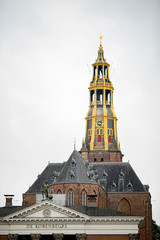 The tower of the Aa church in Groningen behind the former fish market and now supermarket in the...