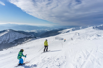 Skiers on a slope in the mountains of Slovakia