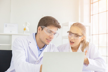 Fototapeta premium The concept of health care researchers, researchers working in biological science laboratories, young research scientists and male supervisors