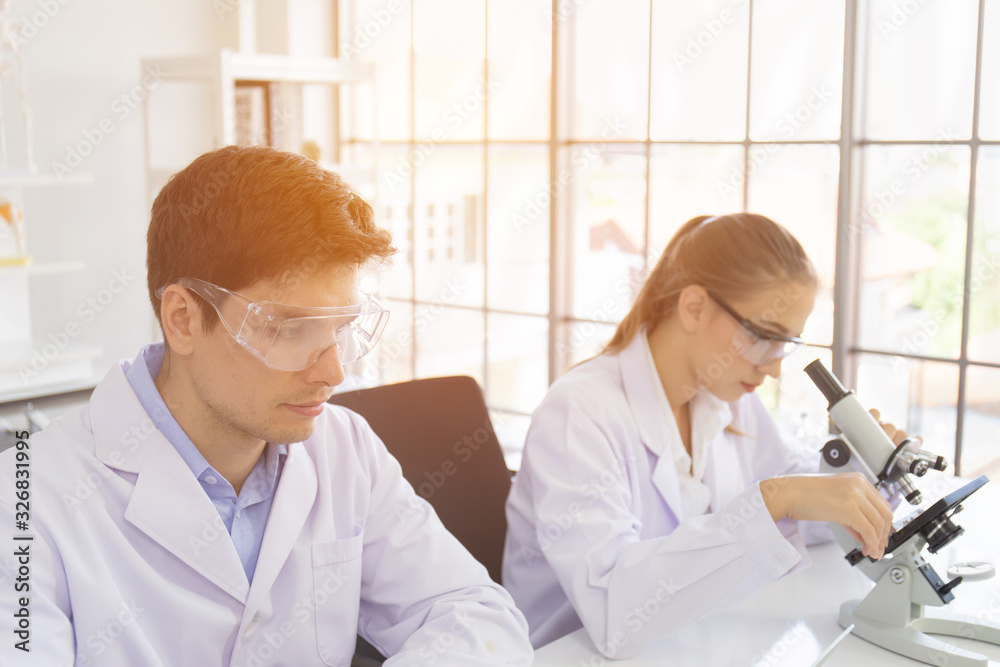 Poster concept of a healthcare researcher, a researcher working in a life science lab, a young research sci