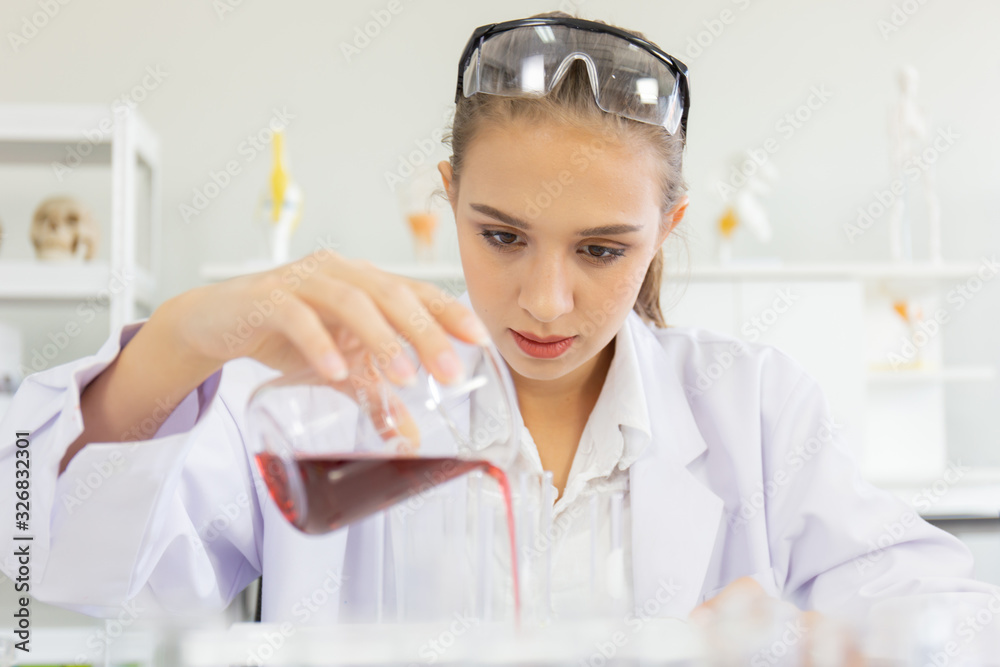 Poster A beautiful female scientist is operating in a science lab with various equipment in the lab.