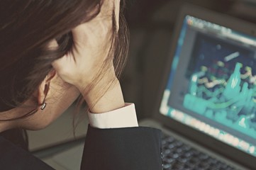 Fototapeta na wymiar Worried stressed business woman in suit shocked by bad news using laptop at work, desperate bankrupt investor lost money online depressed by financial problem debt, frustrated worker tired of overwork