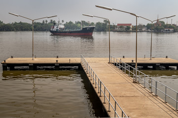 Small pier Extending to the Chao Phraya River in Bangkok.