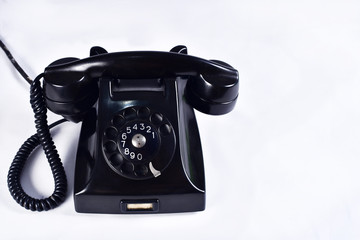 vintage black old telephone handset on white background.