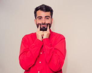 Young man faking a smile