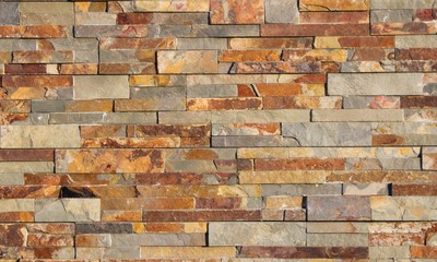 Brick wall with sandstone and granite tones