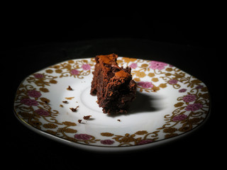 Chocolate brownie isolated on black background