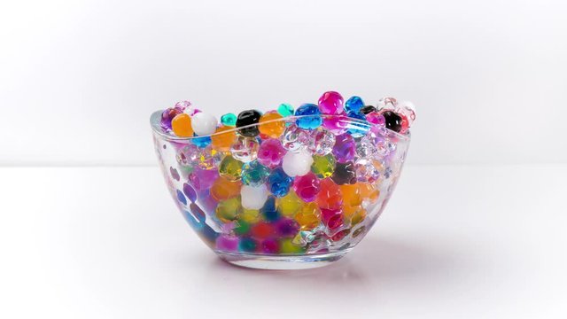 Time lapse of colorful water crystal gel beads growing fast, Concept