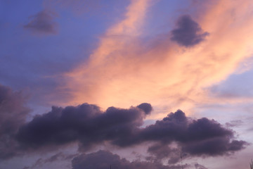 Obraz premium dramatic sunset sky with clouds and sun, close up 